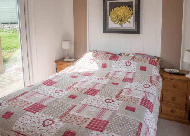 1x double bedroom — ground level (flat screen TV, blackout blinds to all glass doors) 1x loft sleeping area — accessible via loft ladder (a unique experience, best suited to children or adventurous adults)